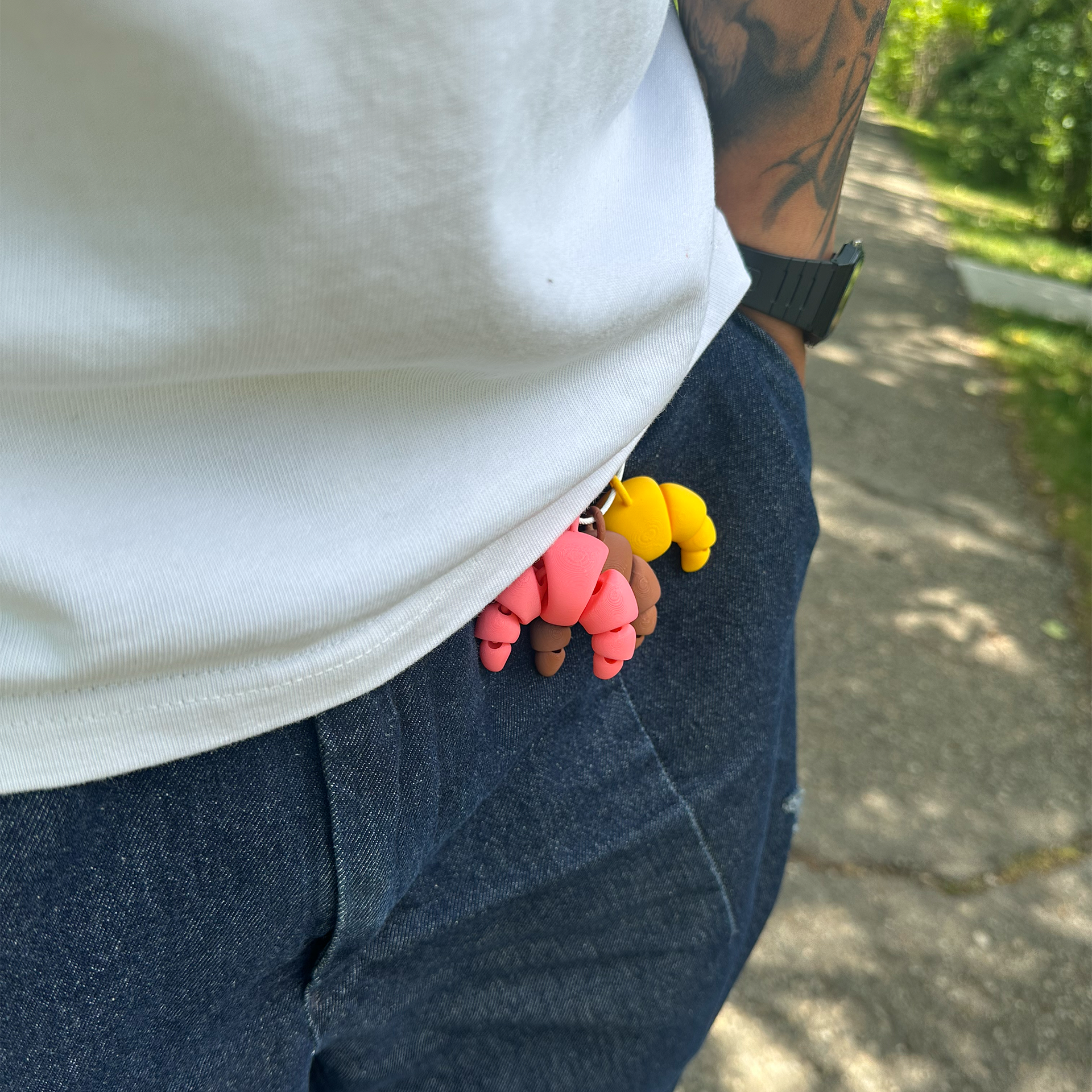 3D printed croissants in yellow, brown and pink PLA, all in a keychain as a fashion accessory – PrintBabe